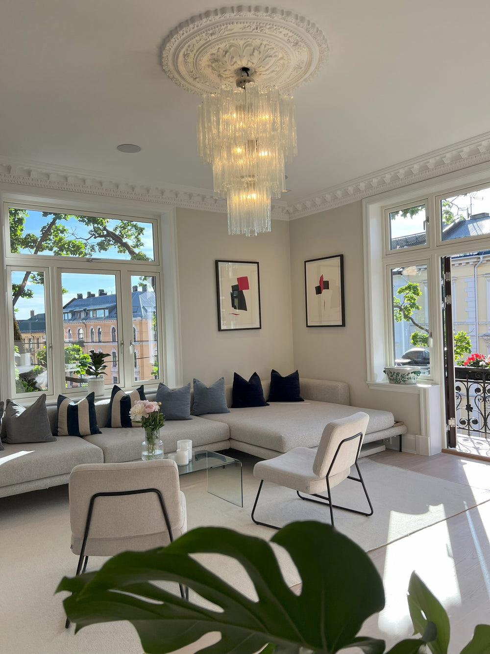 Chandelier with 48 clear glass tubes hung close to the ceiling on the lower rod only